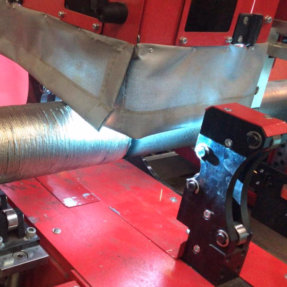 DC welding with natural metal transfer in the automated pipe cladding system